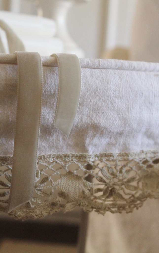 Piping detail and vintage lace make this slipcover very special.