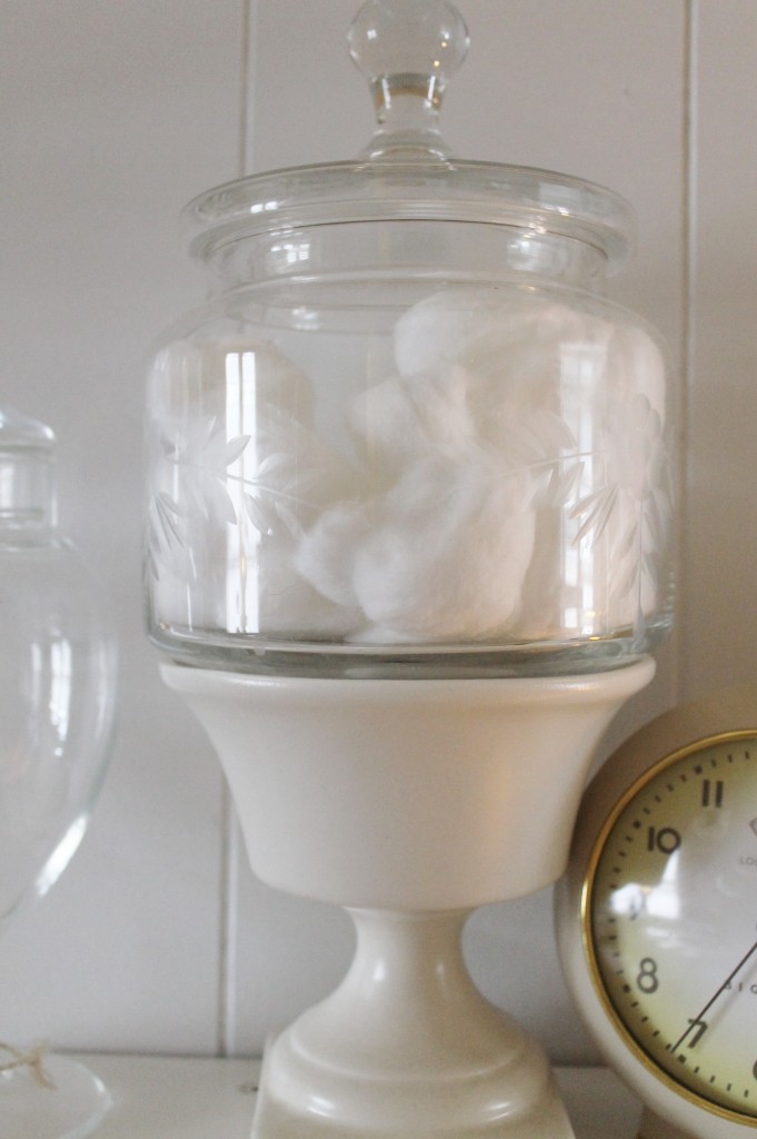 Elevate a vintage jar by setting it in a vintage matte white pottery piece.