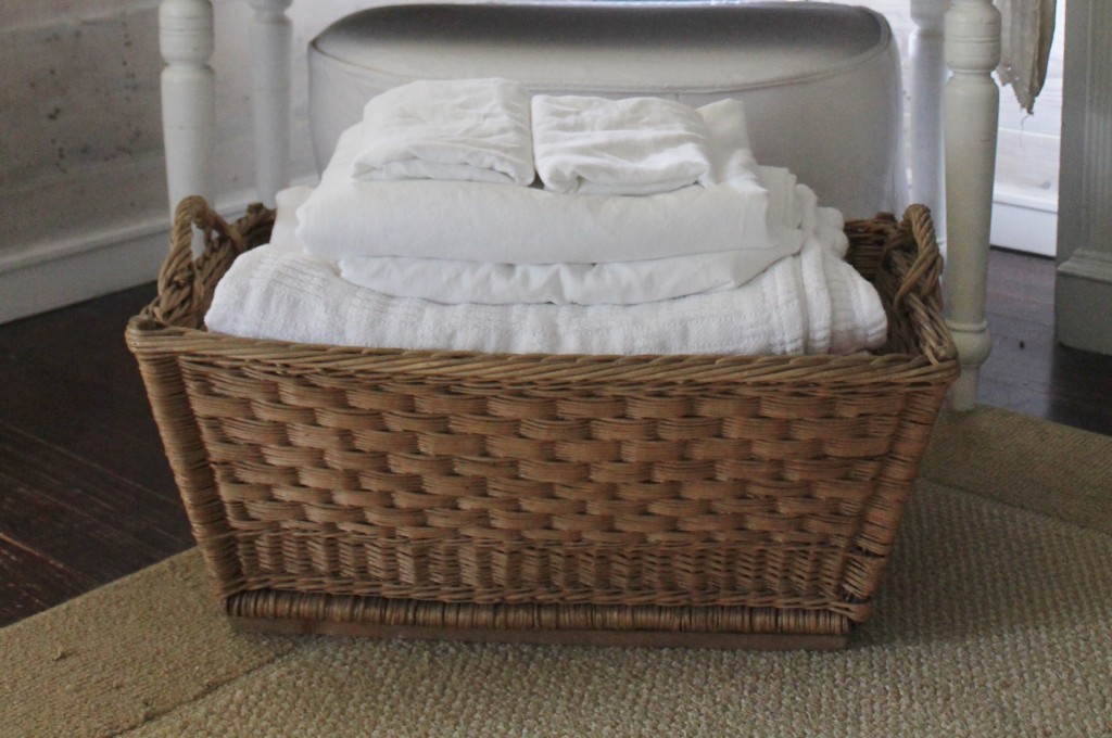Fresh, white and clean sheets with lavender scent in the vintage French Laundry Basekt