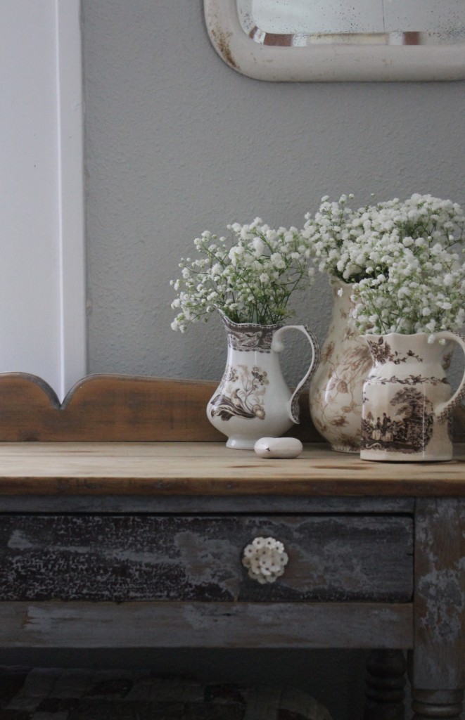 Baby's Breath in antique vessels.