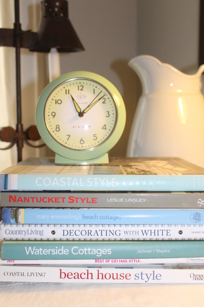 A reproduction vintage alarm clock perched on my coastal design books make for great bedside reading!