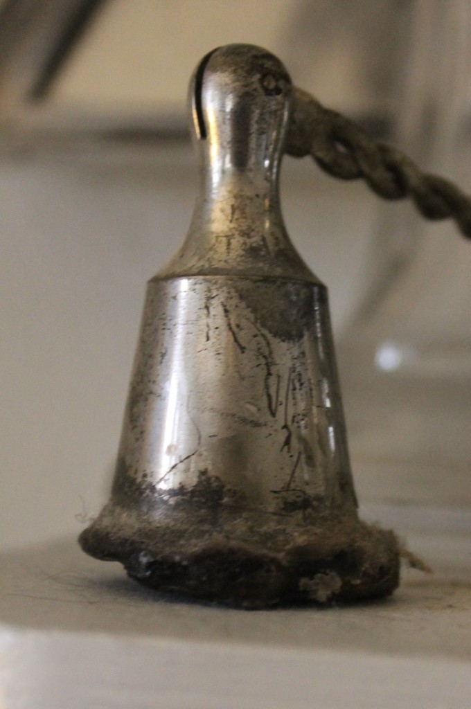 A well used antique candle snuffer.