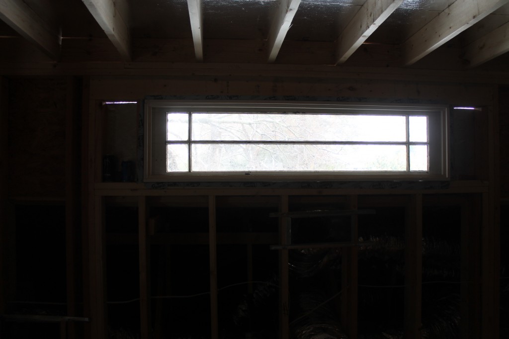 Although the flash didn't engage, hopefully you can see the old side light window in the master bedroom.  The bed will go under this window.