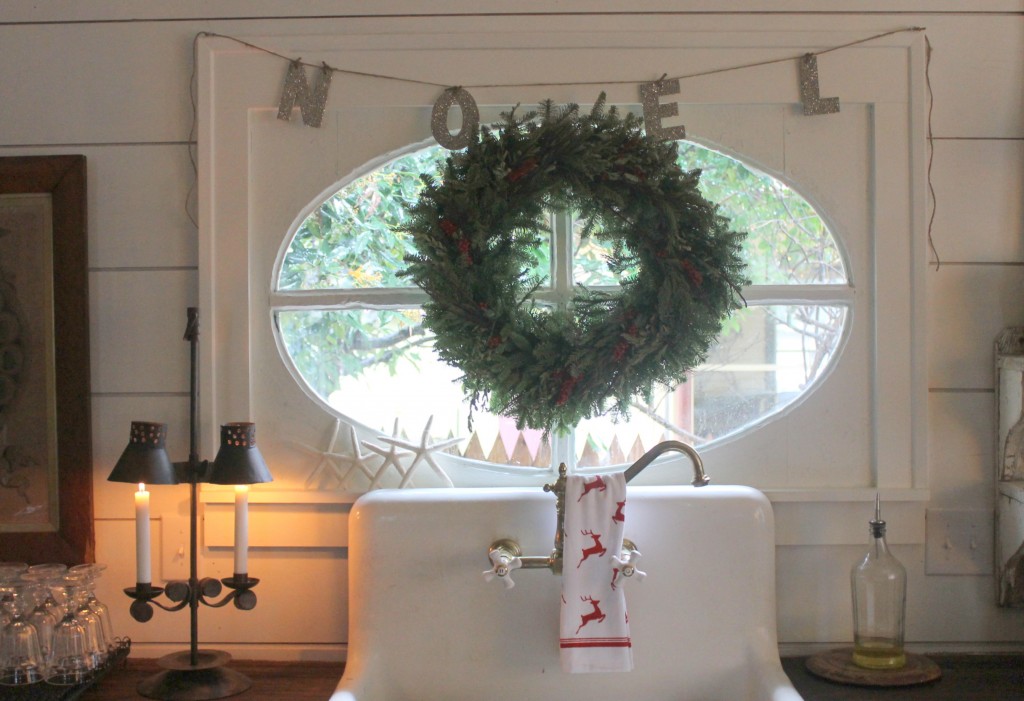 The use of NOEL is apropos of the French farmhouse window above the kitchen sink. 