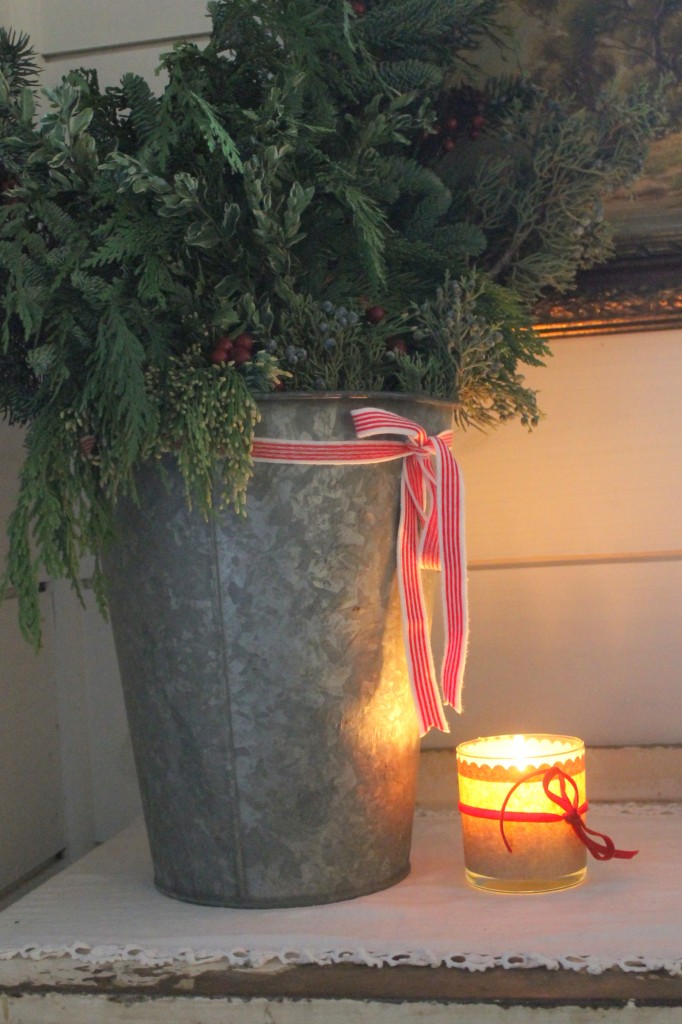 An old sap bucket is a terrific alternative to more expensive vessels to house a holiday arrangement.